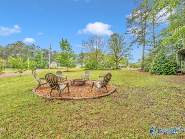 view of yard with a fire pit