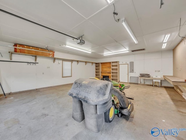 garage featuring a garage door opener and electric panel