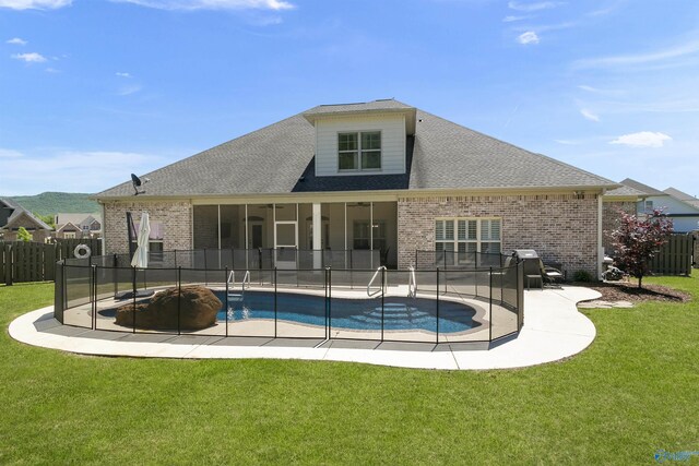 view of swimming pool with a lawn and a patio area