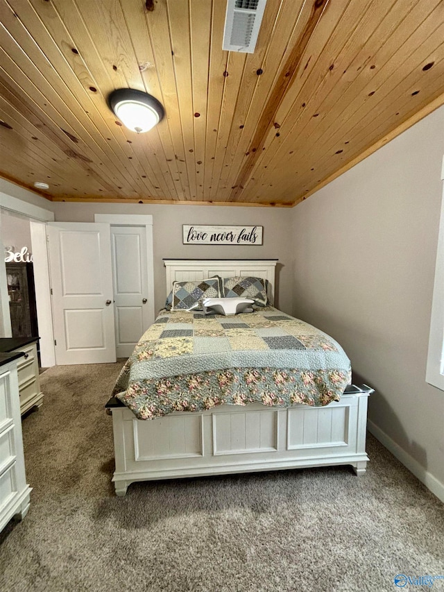 bedroom featuring carpet and wooden ceiling