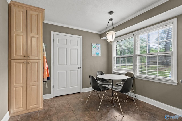 100 Cumberland Cir, Scottsboro, AL 35769 - dining area with dark tile patterned floors, baseboards, ornamental molding, and a textured ceiling