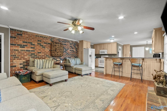 100 Cumberland Cir, Scottsboro, AL 35769 - living area featuring ceiling fan, ornamental molding, and light wood finished floors