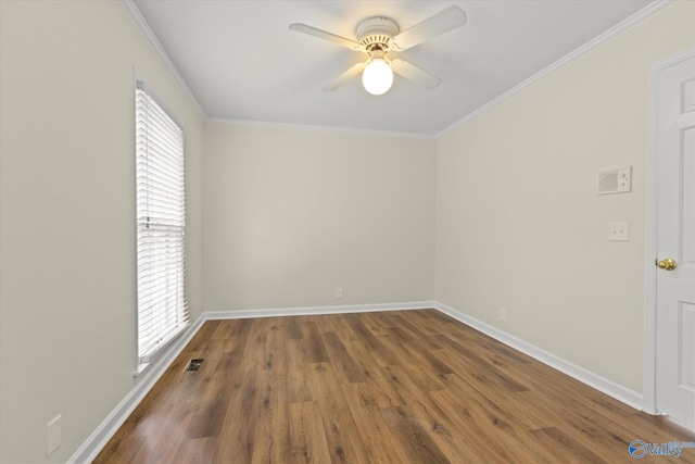 empty room with hardwood / wood-style floors, ceiling fan, and crown molding