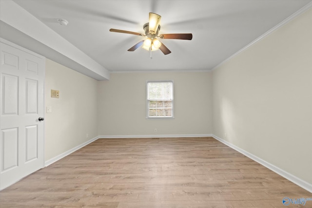 spare room featuring ceiling fan, light hardwood / wood-style floors, and crown molding