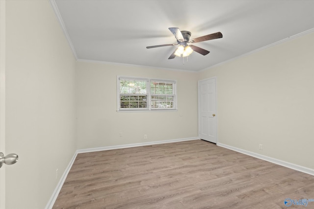 empty room with light wood-type flooring, ornamental molding, and ceiling fan