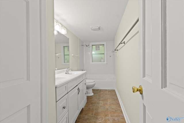 full bathroom featuring vanity, toilet, and tiled shower / bath combo