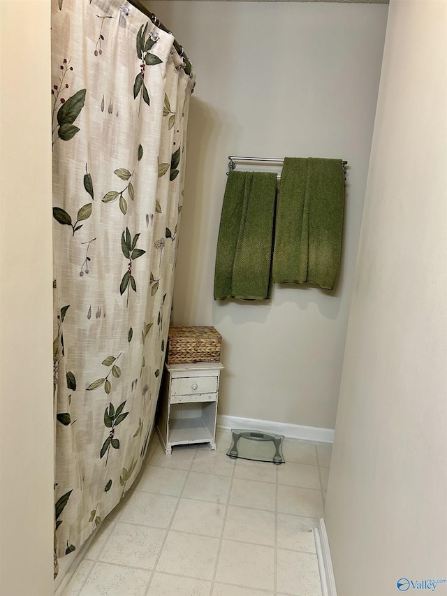 bathroom with curtained shower