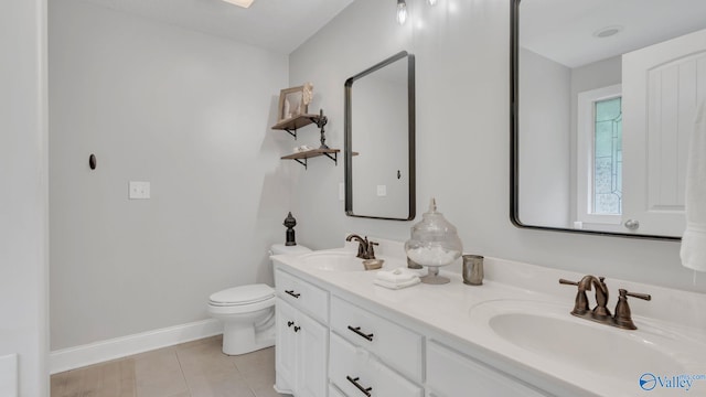 24147 Jacobs Dr, Athens, AL 35613 - full bath with tile patterned flooring, baseboards, toilet, and double vanity
