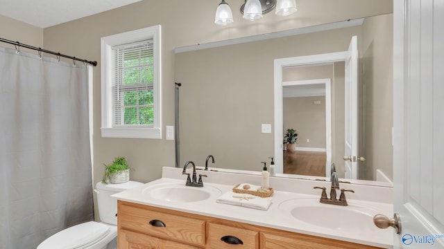 24147 Jacobs Dr, Athens, AL 35613 - full bathroom featuring double vanity and toilet
