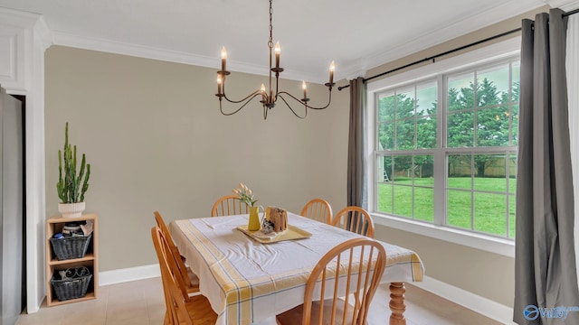 24147 Jacobs Dr, Athens, AL 35613 - dining area featuring a chandelier, light tile patterned floors, baseboards, and crown molding