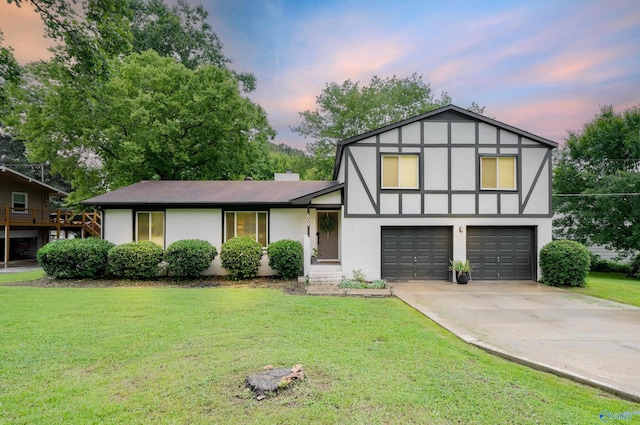 609 Mountain Gap Dr, Huntsville, AL 35083 - view of front facade featuring a garage, a front yard, concrete driveway, and stucco siding