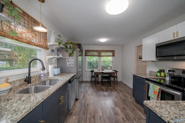 609 Mountain Gap Dr, Huntsville, AL 35083 - kitchen with stainless steel appliances, a textured ceiling, dark wood finished floors, blue cabinetry, and white cabinets
