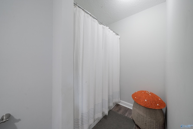 609 Mountain Gap Dr, Huntsville, AL 35083 - bathroom featuring wood finished floors and a textured ceiling