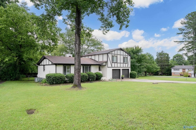 609 Mountain Gap Dr, Huntsville, AL 35083 - english style home featuring a garage, driveway, and a front lawn