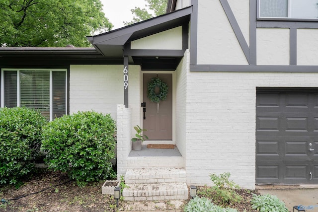 609 Mountain Gap Dr, Huntsville, AL 35083 - property entrance with brick siding, stucco siding, and a garage