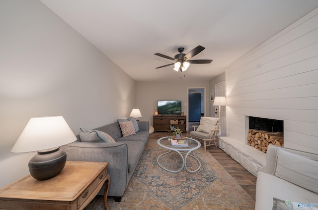 609 Mountain Gap Dr, Huntsville, AL 35083 - living room with wood finished floors, ceiling fan, and a large fireplace