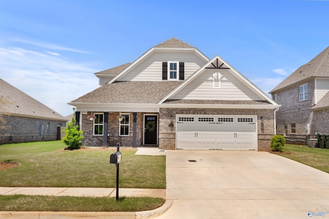 craftsman house with roof with shingles, an attached garage, brick siding, a front yard, and concrete driveway