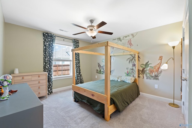 bedroom featuring a ceiling fan, baseboards, visible vents, and light carpet