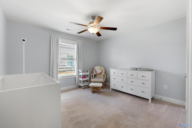 living area with baseboards, ceiling fan, carpet floors, and visible vents