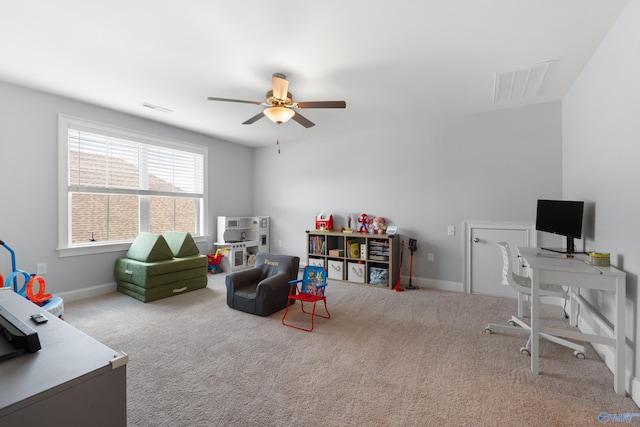 playroom featuring carpet flooring, ceiling fan, and visible vents