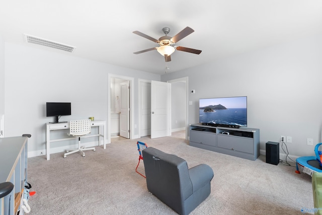 living room with visible vents, baseboards, ceiling fan, and carpet floors