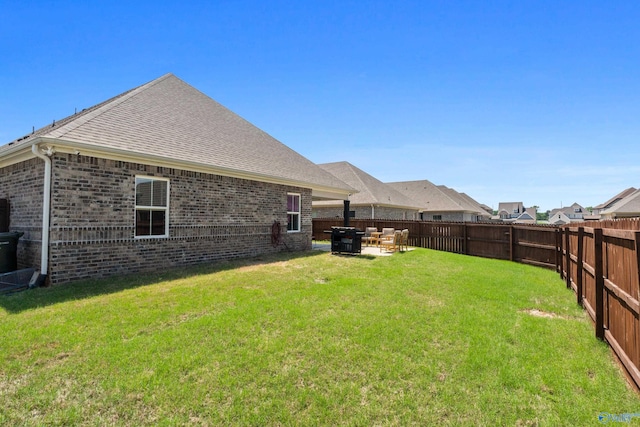 view of yard with a fenced backyard and a patio area