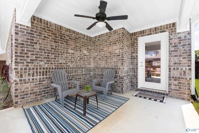 view of patio featuring ceiling fan