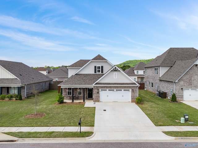 craftsman-style house featuring covered porch, a front yard, brick siding, a shingled roof, and driveway
