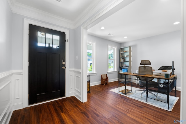 foyer entrance featuring crown molding, recessed lighting, wainscoting, and wood finished floors