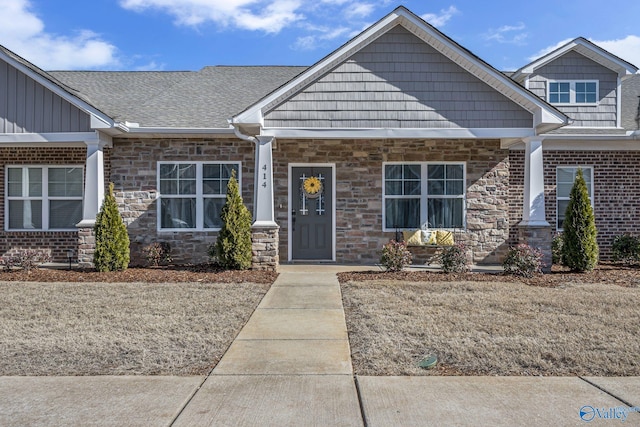 414 Edgebrook Dr, Madison, AL 35756 - craftsman-style house featuring stone siding, roof with shingles, and board and batten siding