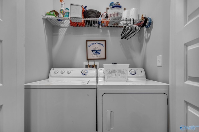 washroom with washer and clothes dryer