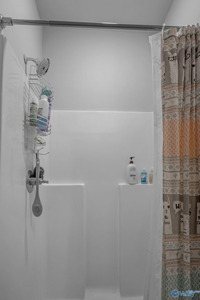 bathroom with a shower with shower curtain