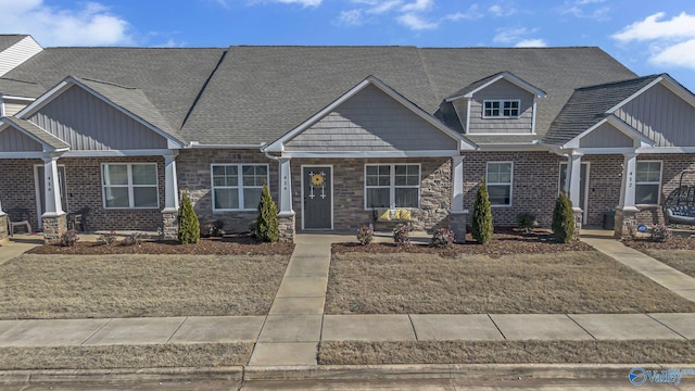 414 Edgebrook Dr, Madison, AL 35756 - craftsman house featuring roof with shingles, stone siding, board and batten siding, and covered porch