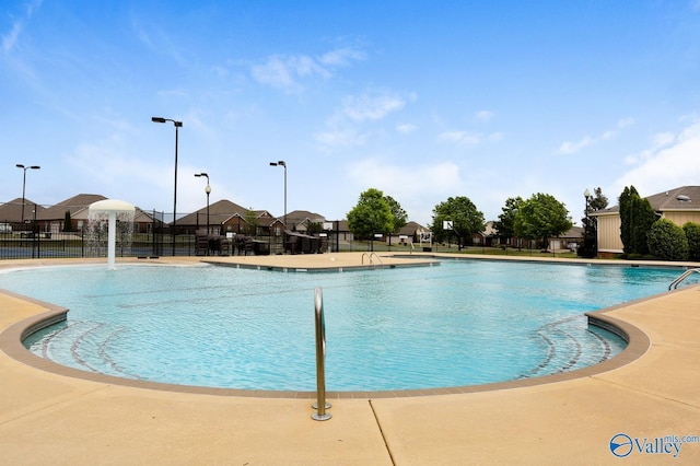 view of swimming pool featuring pool water feature