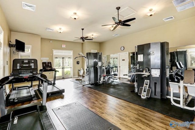 gym with french doors and wood-type flooring