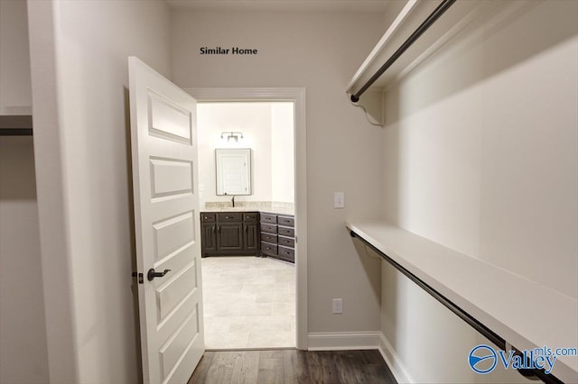 spacious closet featuring wood finished floors