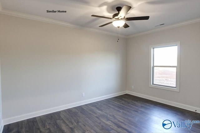 empty room featuring crown molding, ceiling fan, dark wood finished floors, baseboards, and visible vents