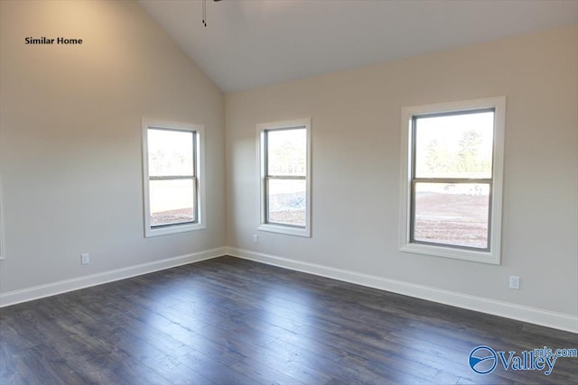 unfurnished room featuring vaulted ceiling, baseboards, dark wood-style floors, and ceiling fan