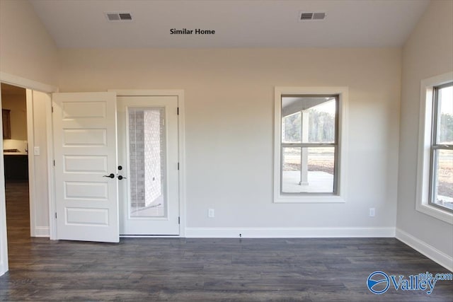 foyer entrance featuring visible vents, baseboards, and dark wood-style flooring