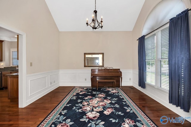 412 Clydebank Dr, Madison, AL 35758 - dining space with a chandelier, dark wood-type flooring, vaulted ceiling, and a wainscoted wall
