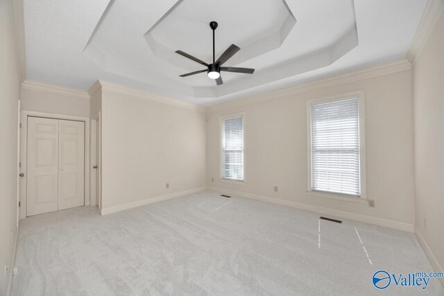 412 Clydebank Dr, Madison, AL 35758 - carpeted empty room featuring a tray ceiling, ceiling fan, ornamental molding, and baseboards