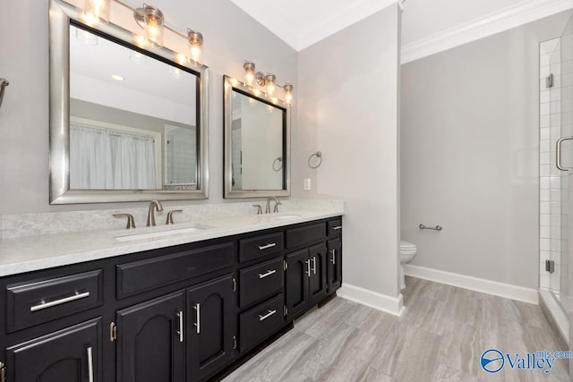 412 Clydebank Dr, Madison, AL 35758 - full bathroom featuring ornamental molding, an enclosed shower, double vanity, baseboards, and toilet