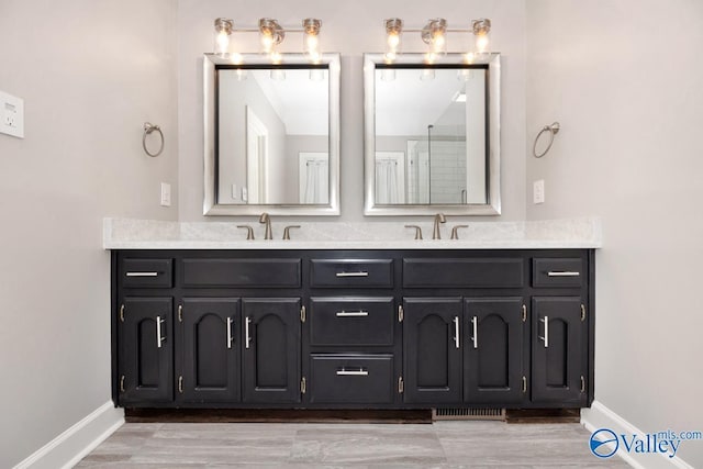 412 Clydebank Dr, Madison, AL 35758 - bathroom featuring baseboards and double vanity