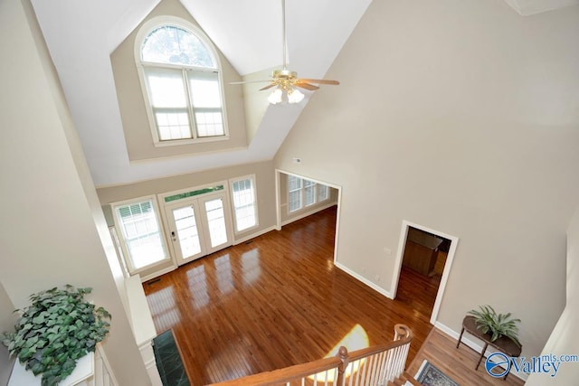 412 Clydebank Dr, Madison, AL 35758 - unfurnished living room with high vaulted ceiling, ceiling fan, wood finished floors, and baseboards