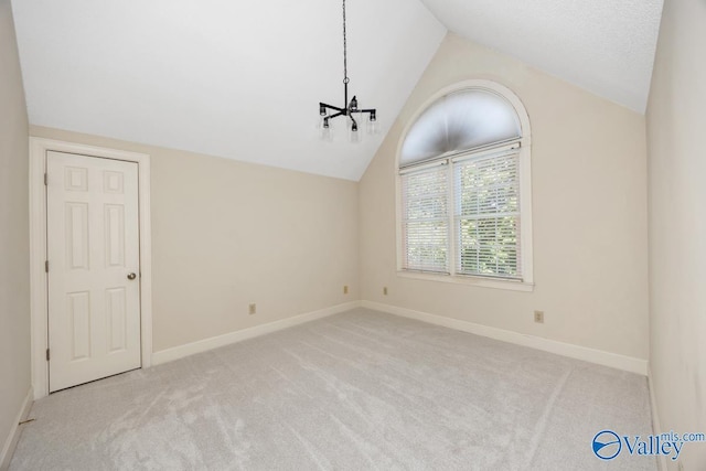 412 Clydebank Dr, Madison, AL 35758 - carpeted spare room with a chandelier, vaulted ceiling, and baseboards