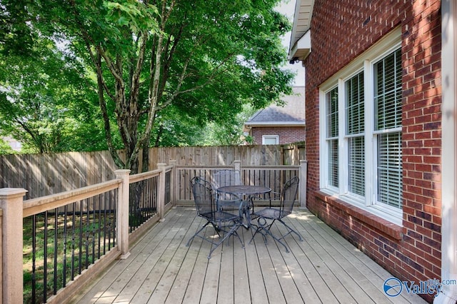 412 Clydebank Dr, Madison, AL 35758 - wooden deck with outdoor dining area and a fenced backyard