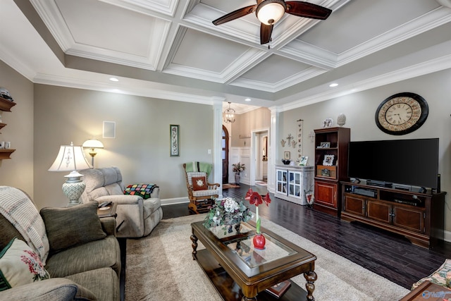 living room featuring coffered ceiling, ceiling fan, dark wood-type flooring, ornamental molding, and decorative columns