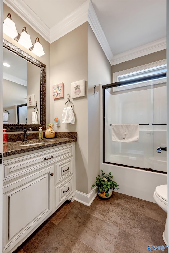 full bathroom featuring crown molding, shower / bath combination with glass door, vanity, and toilet