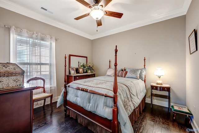 bedroom featuring ceiling fan, dark wood-type flooring, and ornamental molding