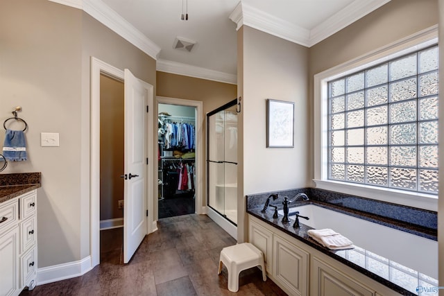 bathroom with vanity, hardwood / wood-style floors, ornamental molding, and plus walk in shower